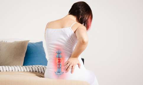 Woman experiencing pain in spine