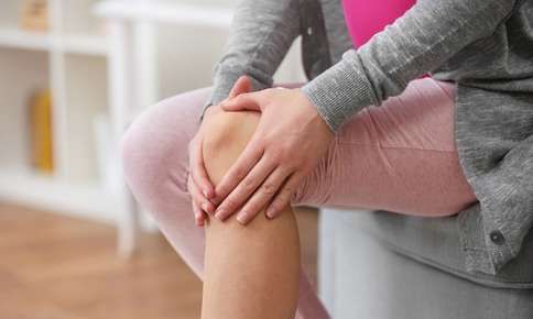 Woman experiencing joint pain